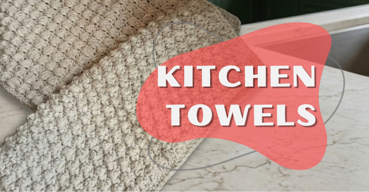 Two beige crochet kitchen towels neatly folded and resting flat on a white marble countertop in a modern kitchen.