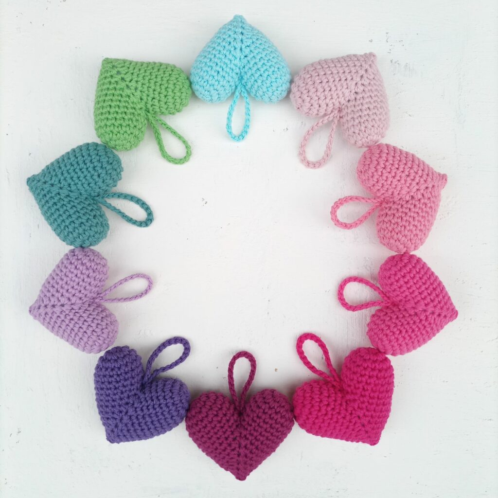 Colorful crochet heart amigurumi in different colors handmade with cotton yarn