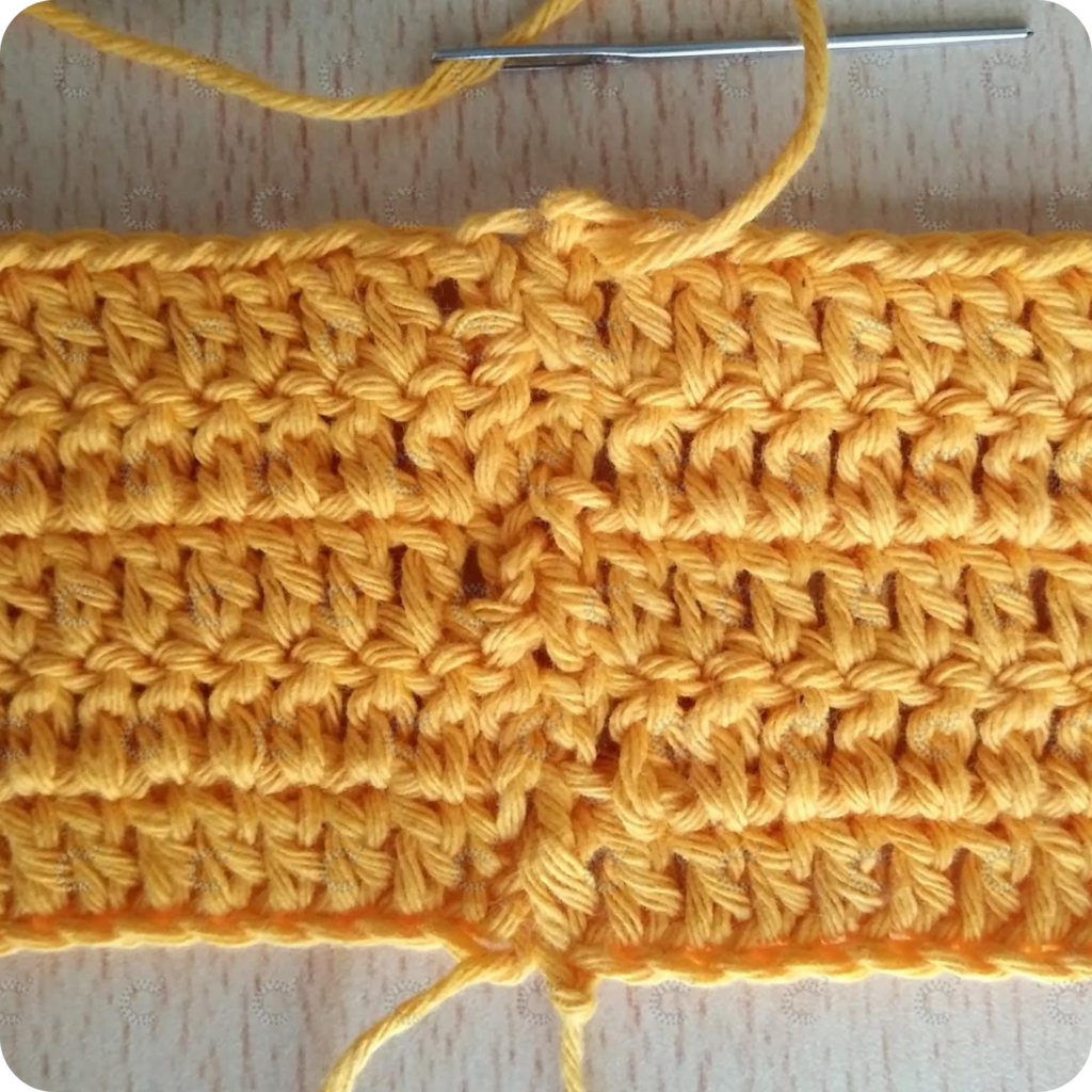 Unión hilera por hilera de cuadrados al crochet con aguja lanera en grannies tejidos en forma lineal